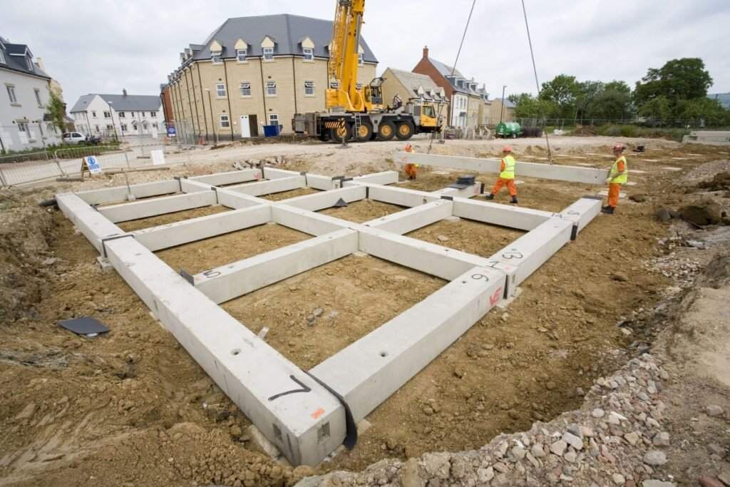 Precast ground beams installed on a housing site